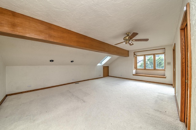 8170 Lake Ridge Dr, Burr Ridge, IL 60527 - bonus room with lofted ceiling, light carpet, a skylight, a ceiling fan, and a textured ceiling
