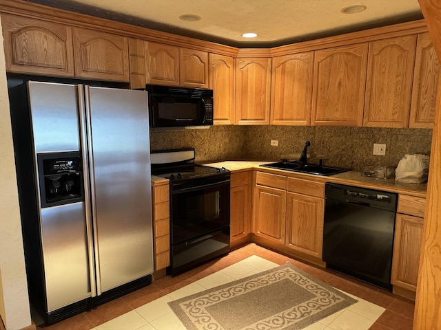 8170 Lake Ridge Dr, Burr Ridge, IL 60527 - kitchen featuring black appliances, light tile patterned floors, backsplash, brown cabinets, and recessed lighting