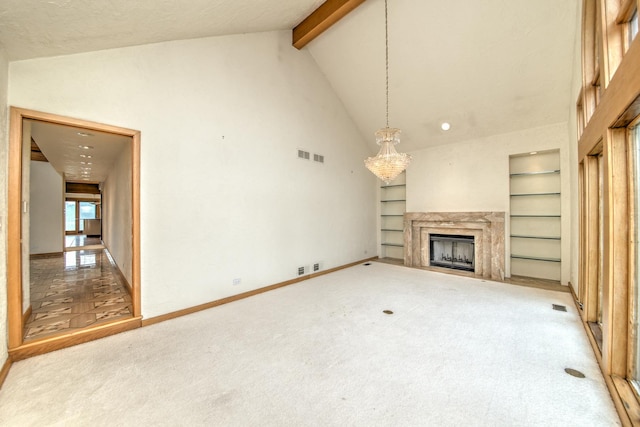 8170 Lake Ridge Dr, Burr Ridge, IL 60527 - unfurnished living room featuring built in shelves, carpet floors, high vaulted ceiling, a high end fireplace, and beam ceiling