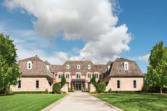 15W170 60th St, Burr Ridge, IL 60527 - view of front of home with a front yard and french doors