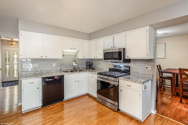 6414 180th St, Tinley Park, IL 60477 - kitchen with stainless steel appliances, light wood-style floors, tasteful backsplash, and white cabinetry