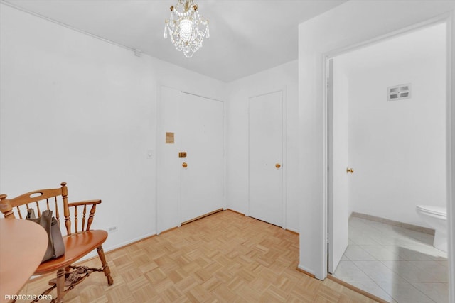 4838 Howard St Unit 301, Skokie, IL 60077 - foyer with a chandelier and baseboards