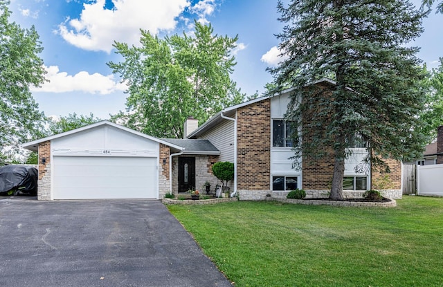 484 Valleyview Dr, Bartlett, IL 60103 - view of front of house with an attached garage, a front lawn, driveway, stone siding, and brick siding