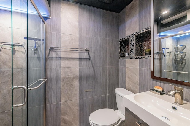 484 Valleyview Dr, Bartlett, IL 60103 - bathroom with tile walls, a stall shower, and vanity