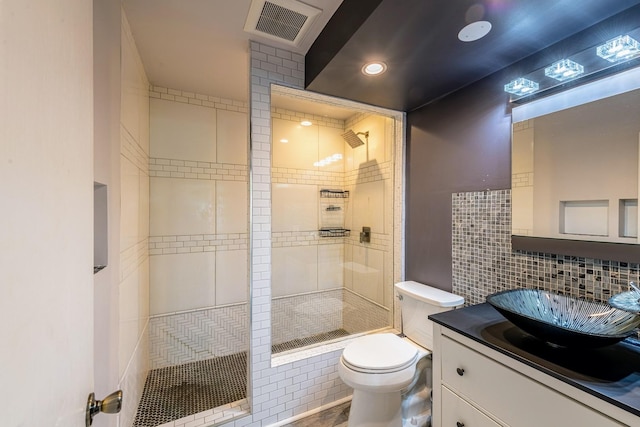 484 Valleyview Dr, Bartlett, IL 60103 - bathroom with tile walls, tiled shower, vanity, and recessed lighting