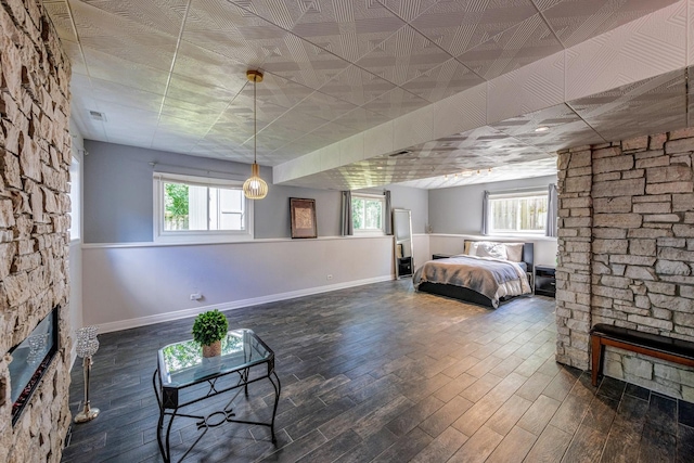 484 Valleyview Dr, Bartlett, IL 60103 - bedroom with a stone fireplace and wood finished floors