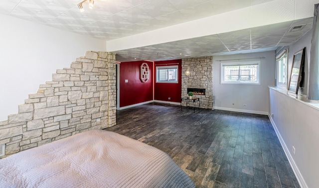 484 Valleyview Dr, Bartlett, IL 60103 - unfurnished living room featuring wood finished floors and a stone fireplace