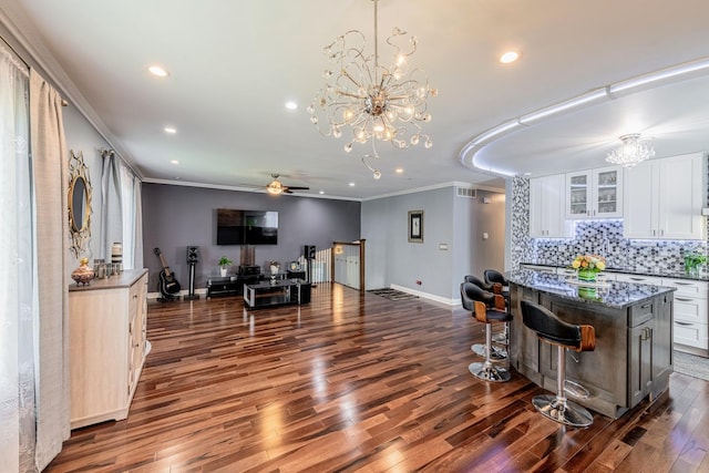 484 Valleyview Dr, Bartlett, IL 60103 - kitchen with a chandelier, crown molding, white cabinets, dark wood-style flooring, and ceiling fan