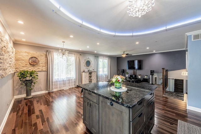 484 Valleyview Dr, Bartlett, IL 60103 - kitchen featuring dark wood-style flooring, a chandelier, recessed lighting, dark stone countertops, and crown molding