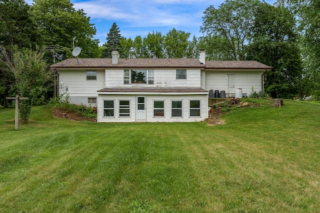 6650 Happy Acres Rd, Rockford, IL 61101 - rear view of house with a chimney and a lawn