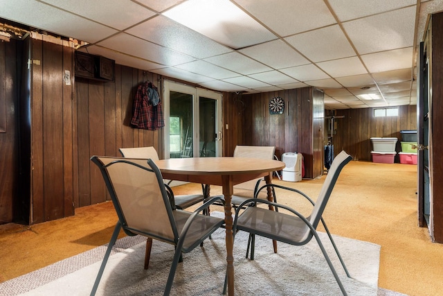 6650 Happy Acres Rd, Rockford, IL 61101 - carpeted dining room featuring a drop ceiling and wooden walls