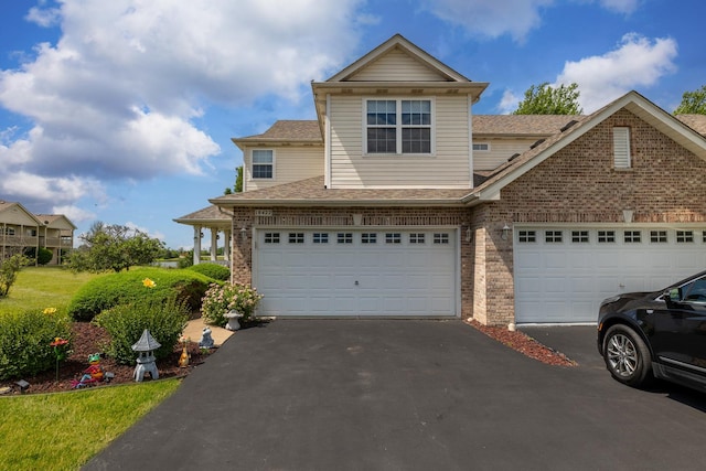 18422 Century Ct, Tinley Park, IL 60477 - view of front of home with driveway, brick siding, and roof with shingles