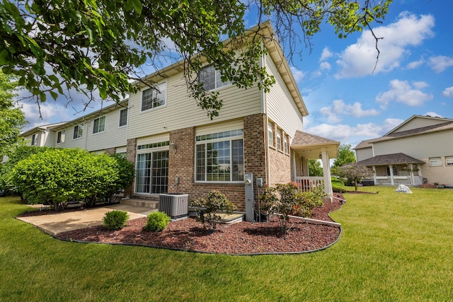 18422 Century Ct, Tinley Park, IL 60477 - back of property with brick siding, a lawn, and a patio