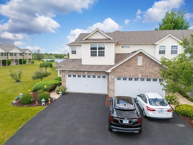 18422 Century Ct, Tinley Park, IL 60477 - view of front of property with asphalt driveway, a front yard, brick siding, a shingled roof, and a water view