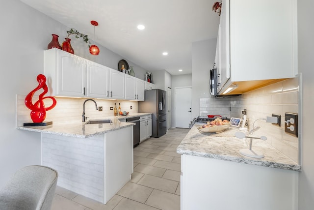 18422 Century Ct, Tinley Park, IL 60477 - kitchen featuring stainless steel appliances, tasteful backsplash, white cabinetry, light stone counters, and recessed lighting
