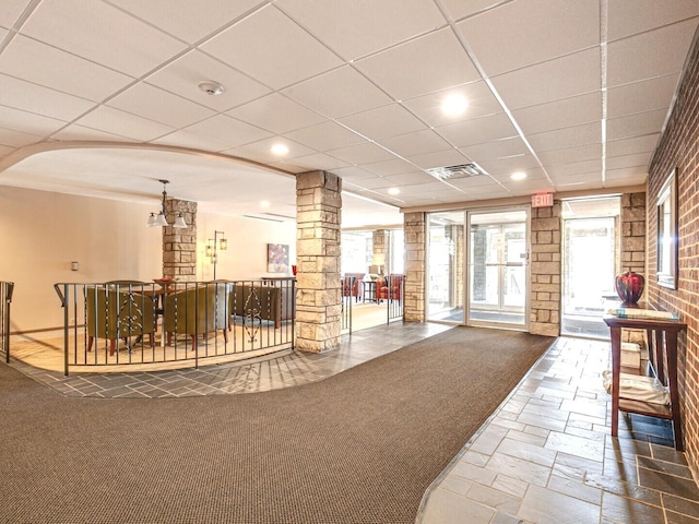 2300 Windsor Mall Unit 2G, Park Ridge, IL 60068 - lobby featuring brick wall and a paneled ceiling