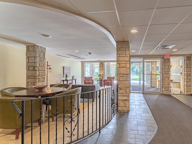2300 Windsor Mall Unit 2G, Park Ridge, IL 60068 - hall with decorative columns, recessed lighting, stone tile floors, and carpet