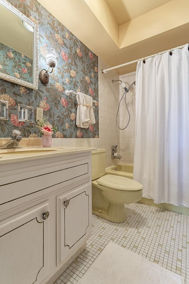 2300 Windsor Mall Unit 2G, Park Ridge, IL 60068 - bathroom with vanity, shower / bath combination with curtain, wallpapered walls, and tile patterned floors