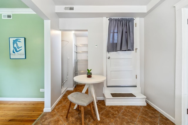 4753 N Talman St Unit 2S, Chicago, IL 60625 - tiled dining space featuring baseboards