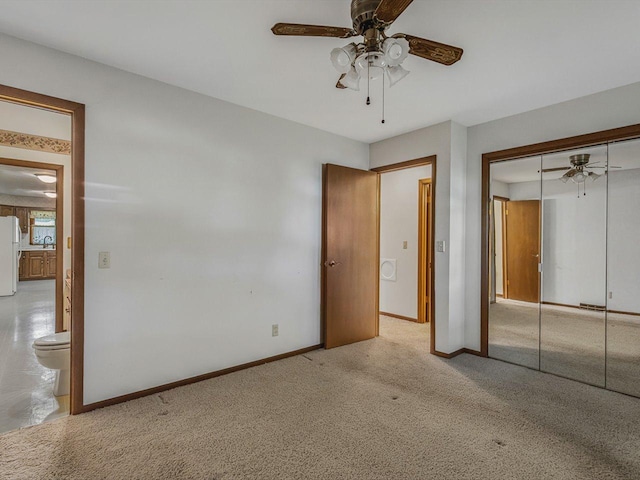 409 Lynne Ln, Belvidere, IL 61008 - unfurnished bedroom with freestanding refrigerator, a closet, carpet, and ceiling fan