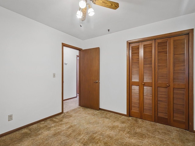 409 Lynne Ln, Belvidere, IL 61008 - unfurnished bedroom with carpet, a closet, and a ceiling fan