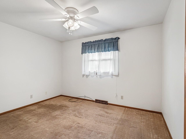 409 Lynne Ln, Belvidere, IL 61008 - carpeted spare room featuring baseboards and a ceiling fan