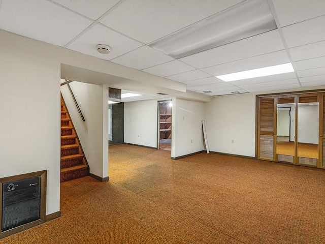 409 Lynne Ln, Belvidere, IL 61008 - finished basement featuring carpet flooring, stairs, a paneled ceiling, and heating unit
