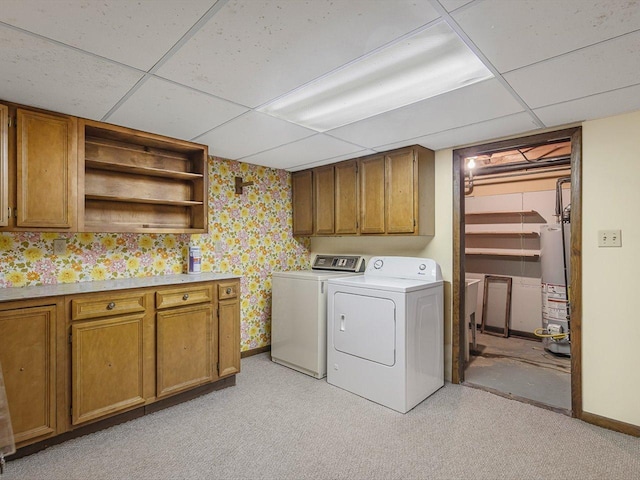 409 Lynne Ln, Belvidere, IL 61008 - laundry area with cabinet space, washing machine and clothes dryer, gas water heater, and wallpapered walls