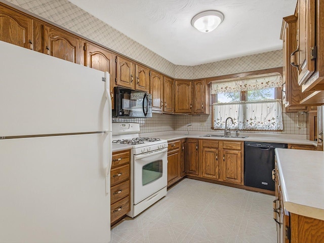 409 Lynne Ln, Belvidere, IL 61008 - kitchen featuring black appliances, brown cabinets, and light countertops
