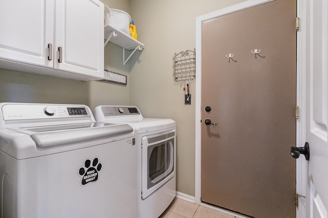 1617 Fieldstone Dr S Unit 13-1, Shorewood, IL 60404 - washroom with washer and clothes dryer, cabinet space, and light tile patterned flooring
