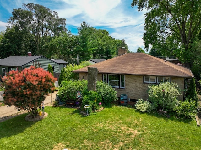 511 Crystal Ave, South Elgin, IL 60177 - back of property featuring a lawn, a chimney, and brick siding