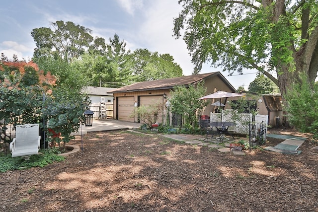 511 Crystal Ave, South Elgin, IL 60177 - back of house featuring a garage and an outdoor structure