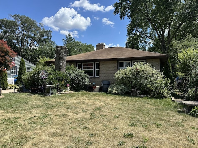 511 Crystal Ave, South Elgin, IL 60177 - rear view of house featuring a yard, a chimney, and brick siding
