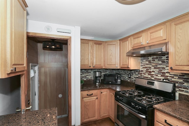 511 Crystal Ave, South Elgin, IL 60177 - kitchen featuring stainless steel range with gas cooktop, under cabinet range hood, tasteful backsplash, and dark stone countertops