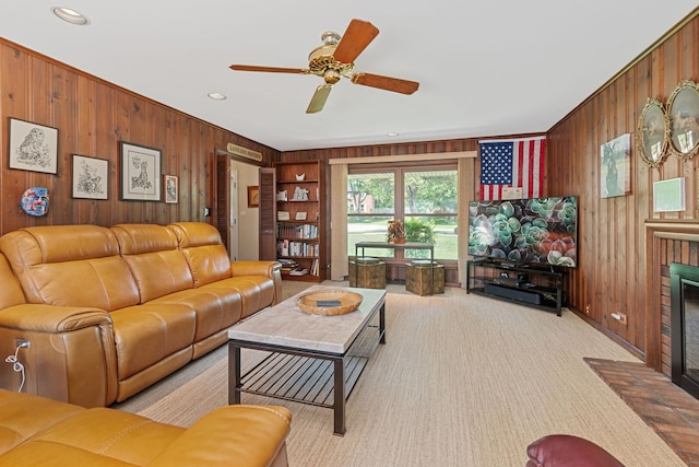 3930 Bordeaux Ct, Northbrook, IL 60062 - carpeted living room with wood walls, a fireplace, a ceiling fan, and recessed lighting