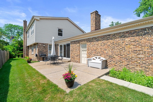 3930 Bordeaux Ct, Northbrook, IL 60062 - rear view of property featuring a chimney, brick siding, and a patio area