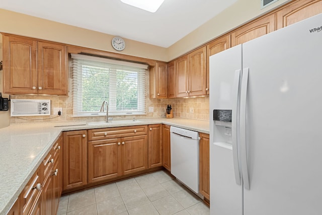 3930 Bordeaux Ct, Northbrook, IL 60062 - kitchen featuring white appliances, tasteful backsplash, light tile patterned floors, brown cabinetry, and light stone counters