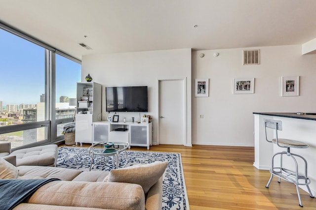 500 W Superior St Unit 1804, Chicago, IL 60654 - living room with light wood-style floors, a view of city, and expansive windows