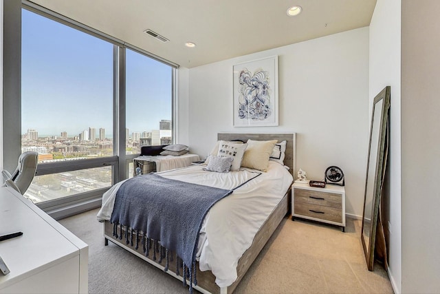 500 W Superior St Unit 1804, Chicago, IL 60654 - bedroom featuring light carpet, a view of city, recessed lighting, and a wall of windows