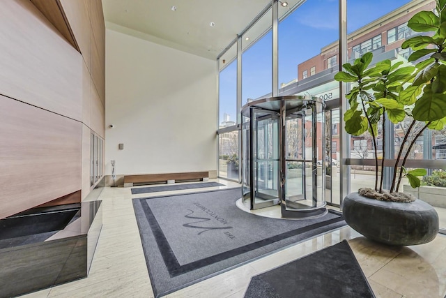500 W Superior St Unit 1804, Chicago, IL 60654 - common area featuring a towering ceiling and a wall of windows