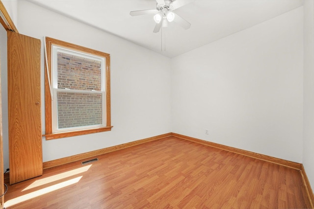 3545 W 62nd Pl, Chicago, IL 60629 - spare room with light wood-style floors and ceiling fan