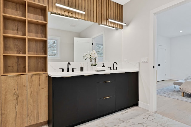 4932 S Martin Luther King Dr, Chicago, IL 60653 - full bathroom with double vanity and marble look tiles