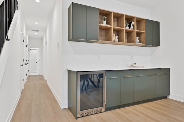 4932 S Martin Luther King Dr, Chicago, IL 60653 - indoor bar featuring beverage cooler, light wood-style floors, and recessed lighting