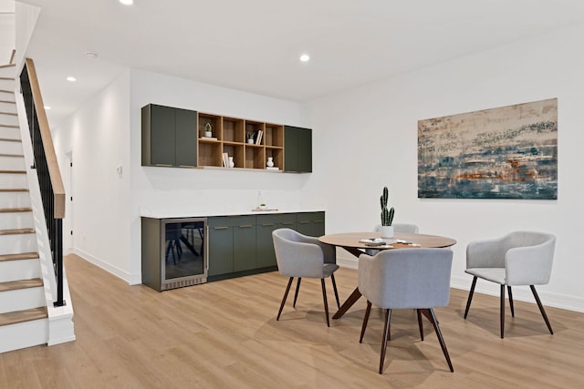 4932 S Martin Luther King Dr, Chicago, IL 60653 - dining room featuring stairway, beverage cooler, bar, light wood-style flooring, and recessed lighting