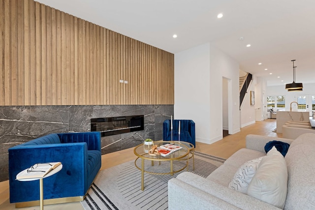 4932 S Martin Luther King Dr, Chicago, IL 60653 - living area featuring a glass covered fireplace, recessed lighting, and light wood finished floors