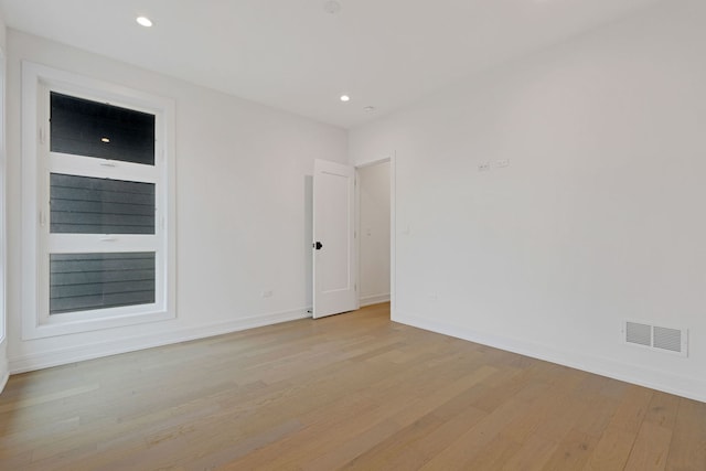 4932 S Martin Luther King Dr, Chicago, IL 60653 - spare room featuring light wood-style floors and recessed lighting