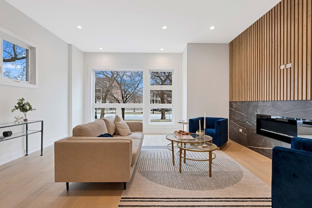 4932 S Martin Luther King Dr, Chicago, IL 60653 - living room with wood finished floors, healthy amount of natural light, recessed lighting, and a glass covered fireplace