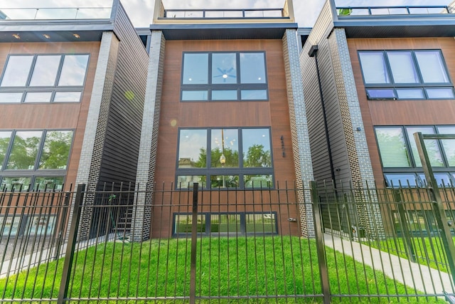 4210 W 5th Ave, Chicago, IL 60624 - view of building exterior featuring a fenced front yard