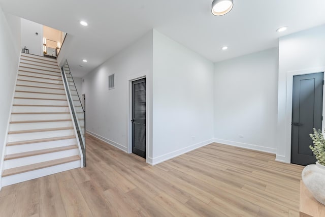 4210 W 5th Ave, Chicago, IL 60624 - unfurnished living room with light wood-type flooring, stairway, and recessed lighting