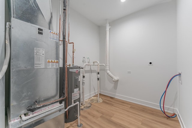 4210 W 5th Ave, Chicago, IL 60624 - utility room featuring heating unit and electric water heater